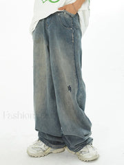 Men’s Faded Patchwork Distressed Loose Jeans Blue / M loose jeans